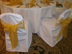 White Chair Cover with Gold Organza Sash